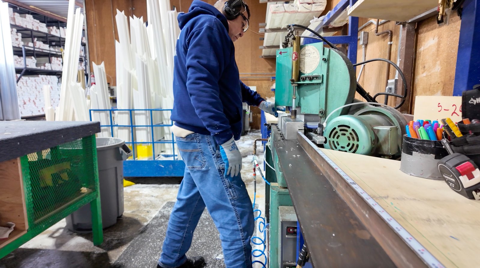 Lexmark factory worker operating CNC cutting equipment