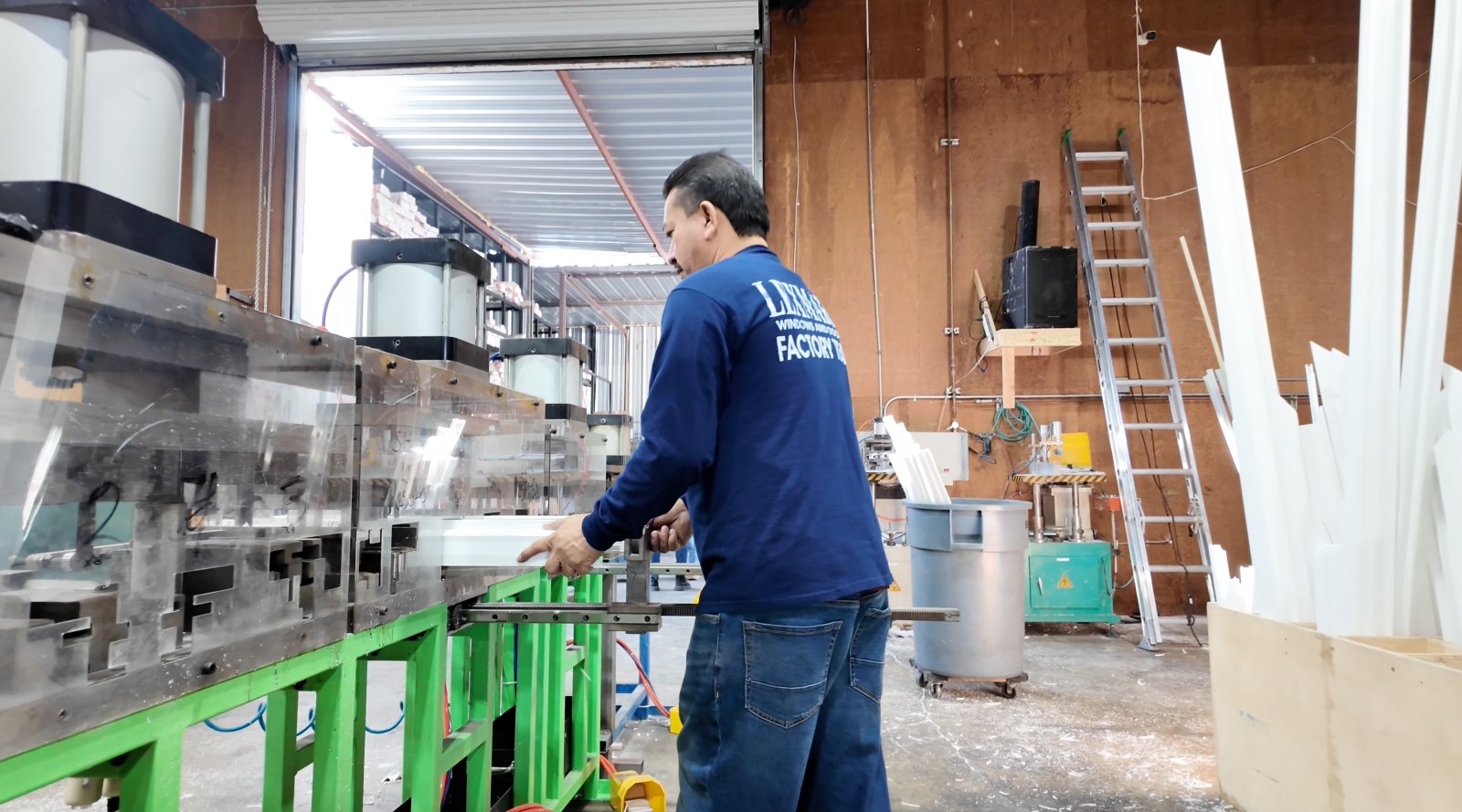 Lexmark team member operating frame welding machine