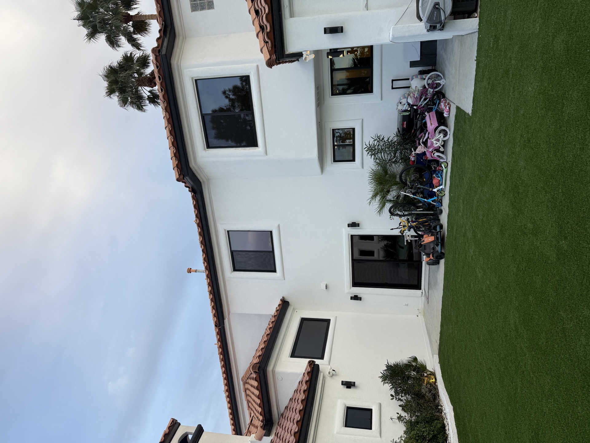 Modern home exterior with Lexmark Onix series black vinyl windows