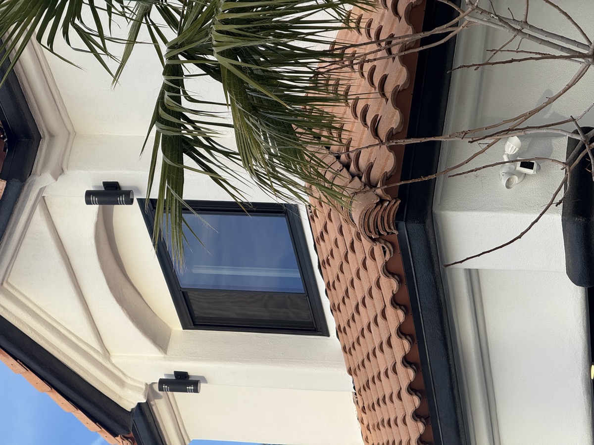Home exterior with Lexmark Onix series black vinyl windows