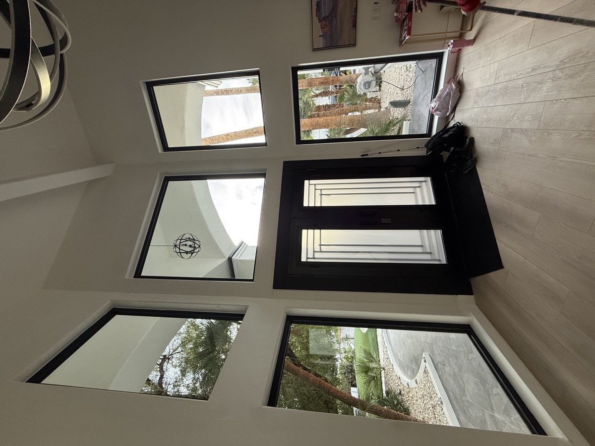 Lexmark home interior with Onix series black-framed windows and entry door